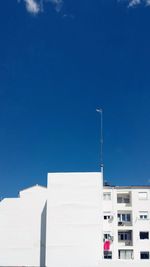 Low angle view of building against blue sky