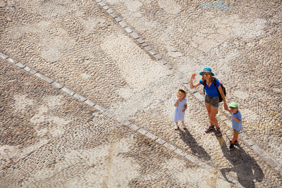 High angle view of people walking on street