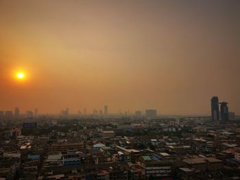 High angle view of buildings against sky during sunset