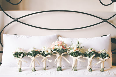 Close-up of wedding bouquets on bed