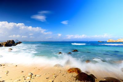 Scenic view of sea against cloudy sky