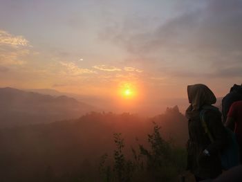 Scenic view of mountains against sky during sunset