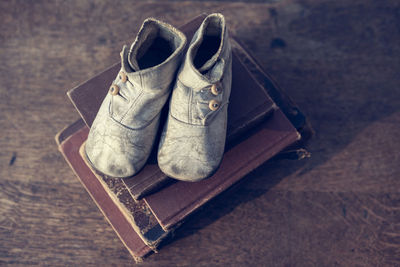 High angle view of shoes on wooden table