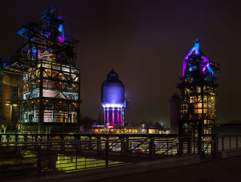 Illuminated buildings in city at night