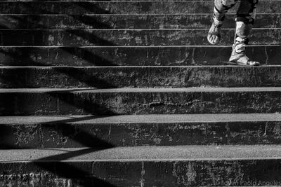 Low section of person standing on steps