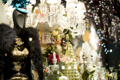 Close-up of christmas decorations hanging on display at store