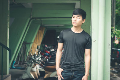 Portrait of young man standing indoors