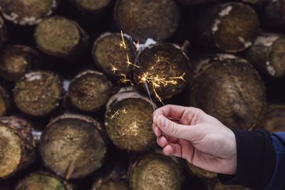 Close-up of hand holding sparkler