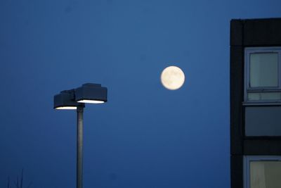 Low angle view of street light against sky