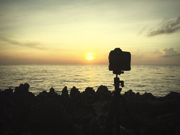Scenic view of sea at sunset