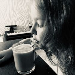 Girl drinking coffee on table