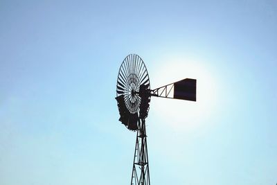 Low angle view of windmill against sky