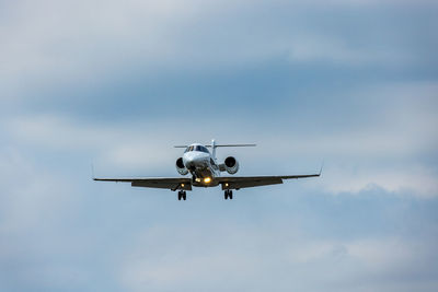 Low angle view of airplane flying in sky