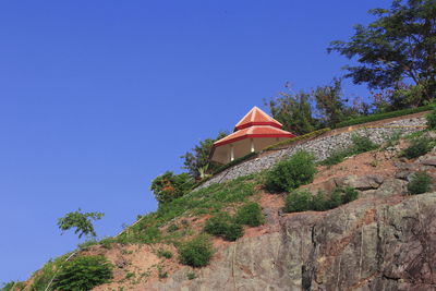 Low angle view of building against clear blue sky