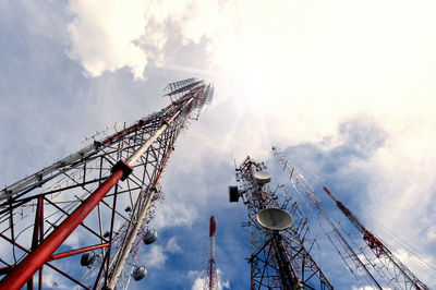 Low angle view of communications tower against sky