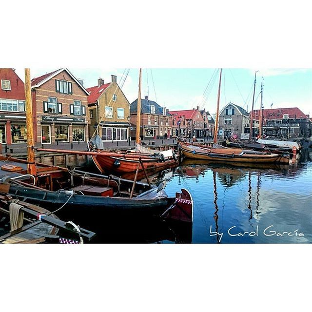 BOATS MOORED IN HARBOR