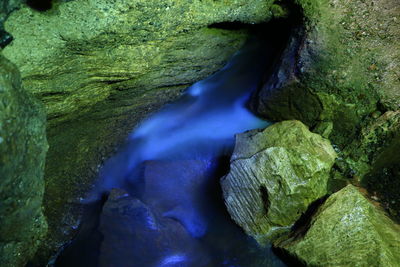 Close-up of water flowing from rock formation