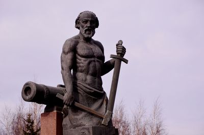 Low angle view of statue against sky