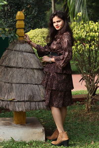 Cropped hand of man standing by plants