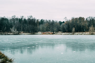 Scenic view of frozen lake against sky