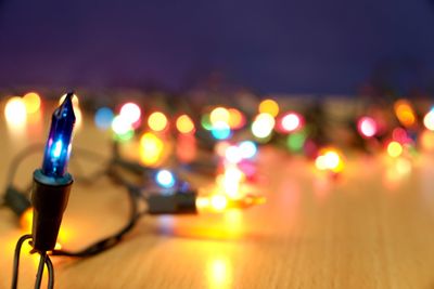 Close-up of illuminated candles on table