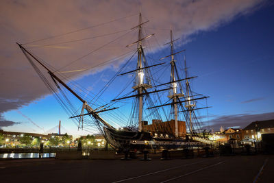 Uss constitution ship at museum against cloudy sky at dusk