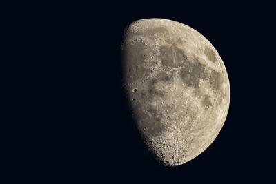 Low angle view of moon over black background