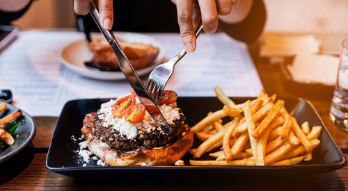 Midsection of person preparing food on table