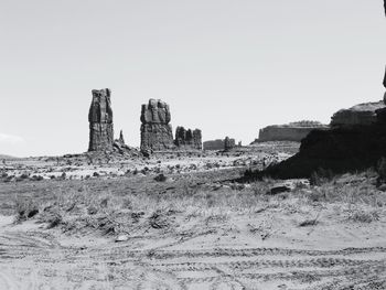 Old ruin building on field against clear sky