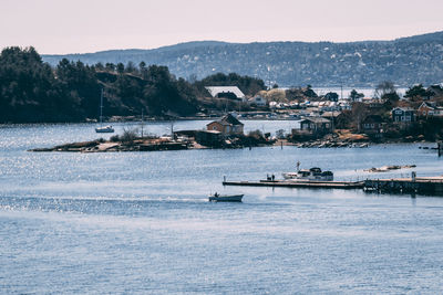 Scenic view of sea against buildings