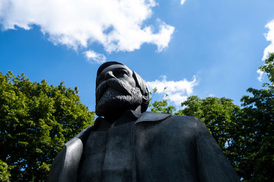 Low angle view of statue against sky