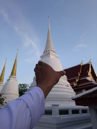 Low angle view of pagoda against building