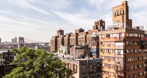 Buildings against cloudy sky