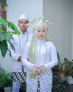 Bride and groom praying together