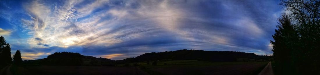 Scenic view of landscape against sky during sunset
