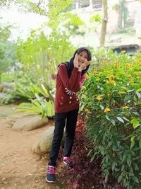 Full length of young woman standing on land