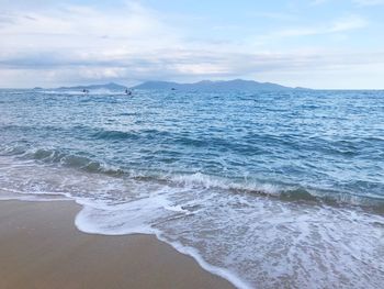 Scenic view of sea against cloudy sky