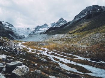 Scenic view of mountains against sky during winter