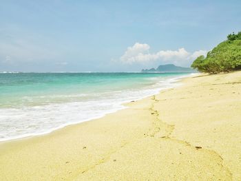 Scenic view of beach against sky