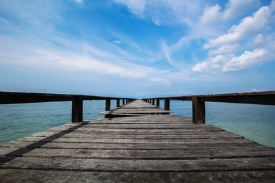 Pier over sea against sky