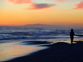 Scenic view of sea at sunset