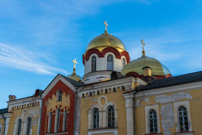 Low angle view of building against blue sky