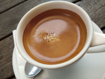 High angle view of coffee cup on table