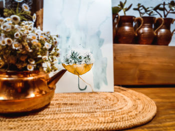 Close-up of wine in glass vase on table