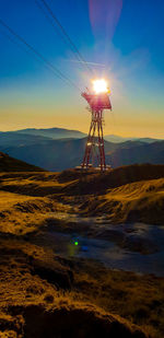 Scenic view of land against sky during sunset