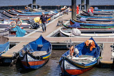 Boats moored at harbor