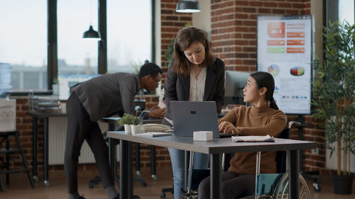 Business colleagues working at office