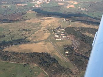 Aerial view of landscape seen through airplane window