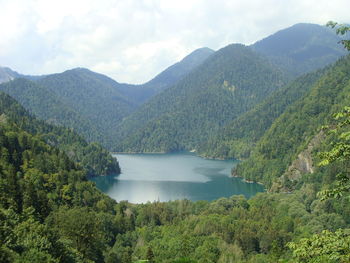 Scenic view of lake and mountains against sky