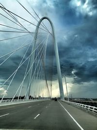 Low angle view of suspension bridge against sky
